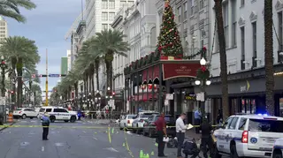 New Orleans police investigate the scene of a shooting