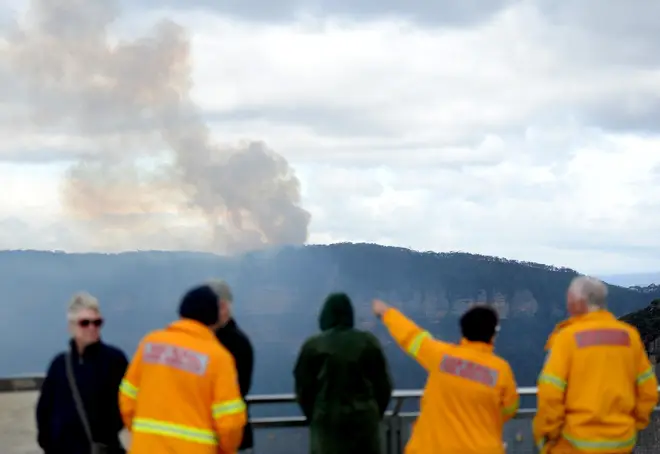 Smoke is seen as a fire continues to burn in Katoomba, Blue Mountains, Sydney