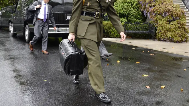 A US Marine Corps officer carries the football