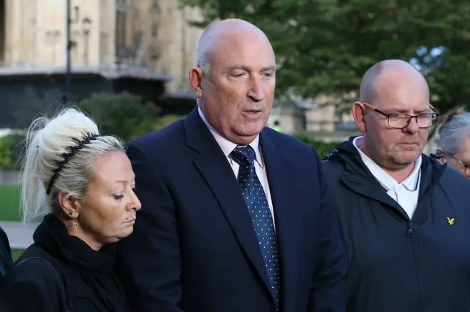 Harry Dunn's mother Charlotte Charles and father Tim Dunn with family spokesman Radd Seiger (centre)
