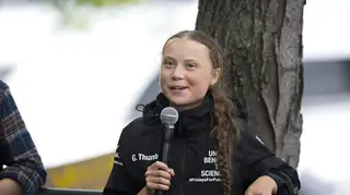 Greta Thunberg talks to reporters after her arrival to New York in August