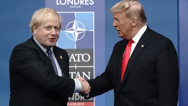 Donald Trump shakes hands with Boris Johnson at the Nato summit today