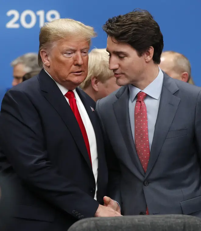 Donald Trump and Canadian Prime Minister Justin Trudeau shake hands at the summit