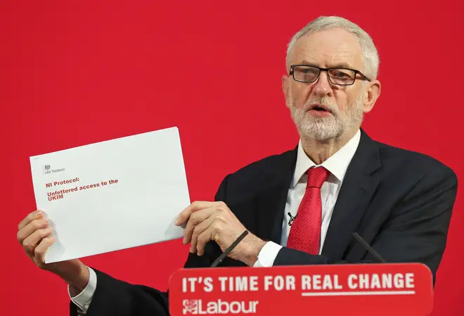 Jeremy Corbyn holds up the leaked document