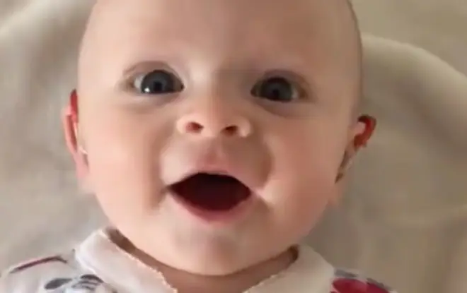 Four-month-old Georgina was all smiles as her hearing aids were turned on