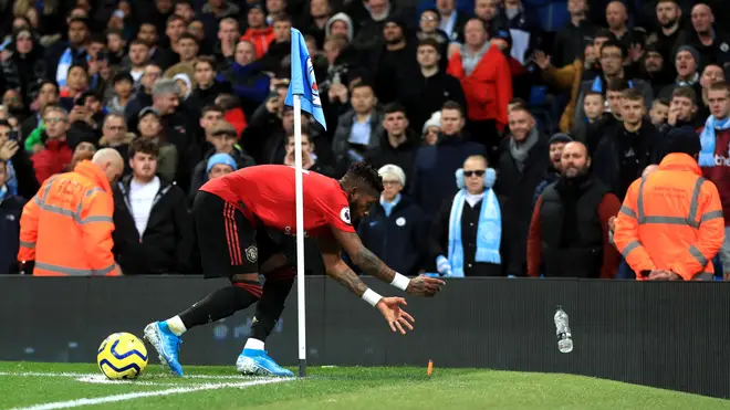 Manchester United's Fred reacts after objects are thrown at him during the Premier League match
