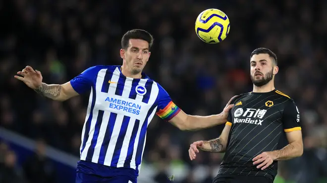 Brighton and Hove Albion's Lewis Dunk (left) and Wolverhampton Wanderers' Patrick Cutrone