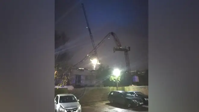 The crane collapsed on Fassett Road in Kingston upon Thames on Tuesday evening