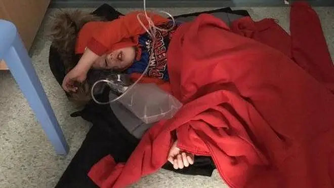 Jack Williment was pictured laying on the floor of a hospital