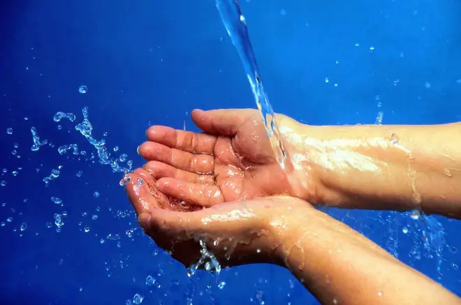 Water being poured on hands
