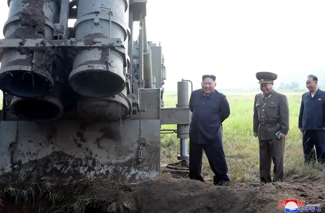 Kim Jong Un seen inspecting a rocket launcher in September