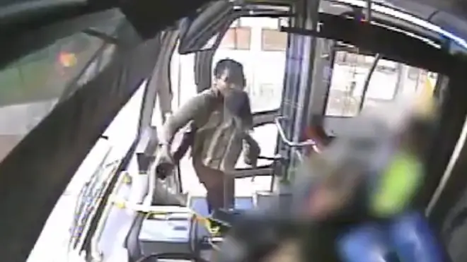 CCTV captured the moment a woman threw a cup of urine at a bus driver.