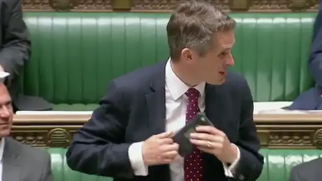 Gavin Williamson had to pull the phone out of his suit jacket pocket