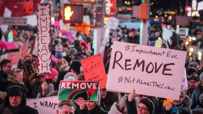 Anti-Trump protesters gathered on Tuesday ahead of the vote
