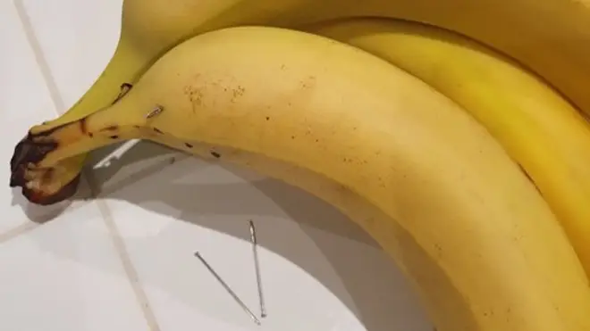 The boy bit into a banana which had a long needle inside it