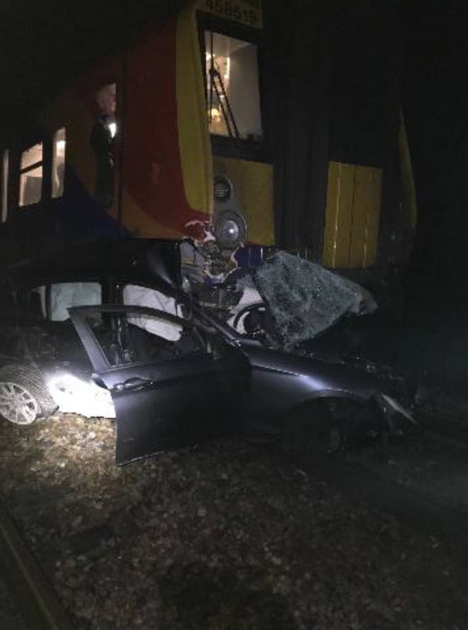 The car was shown crushed after being hit by a train