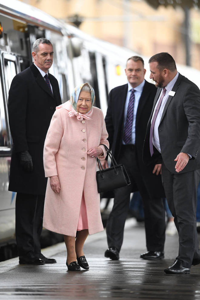 Queen Elizabeth II arrives at King's Lynn railway station in Norfolk, after travelling from London at the start of her traditional Christmas break