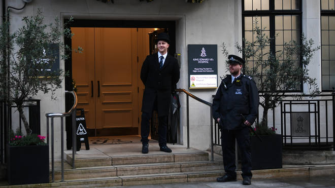 A police officer outside the King Edward VII's Hospital