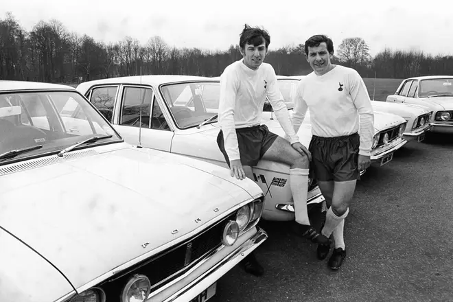 Tottenham Hotspur and England's Martin Peters (left) and Alan Mullery (right) pose with their new Ford Cortinas