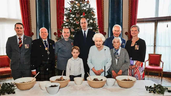 Veterans Liam Young, Colin Hughes, Alex Cavaliere, Barbra Hurman and Lisa Evans pose alongside the royal family in the Music Room at Buckingham Palace