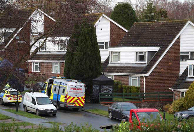 Police at a scene in Hazel Way, Crawley Down, West Sussex, where two people are feared dead after a reported stabbing.