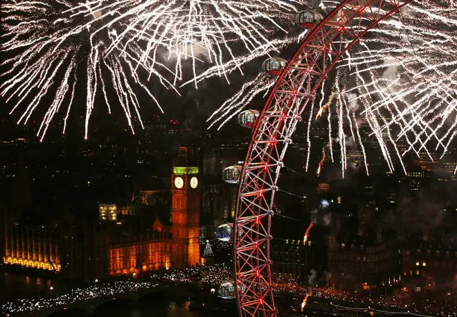 Fireworks light up the sky over Big Ben and the London Eye in central London during the New Year celebrations.