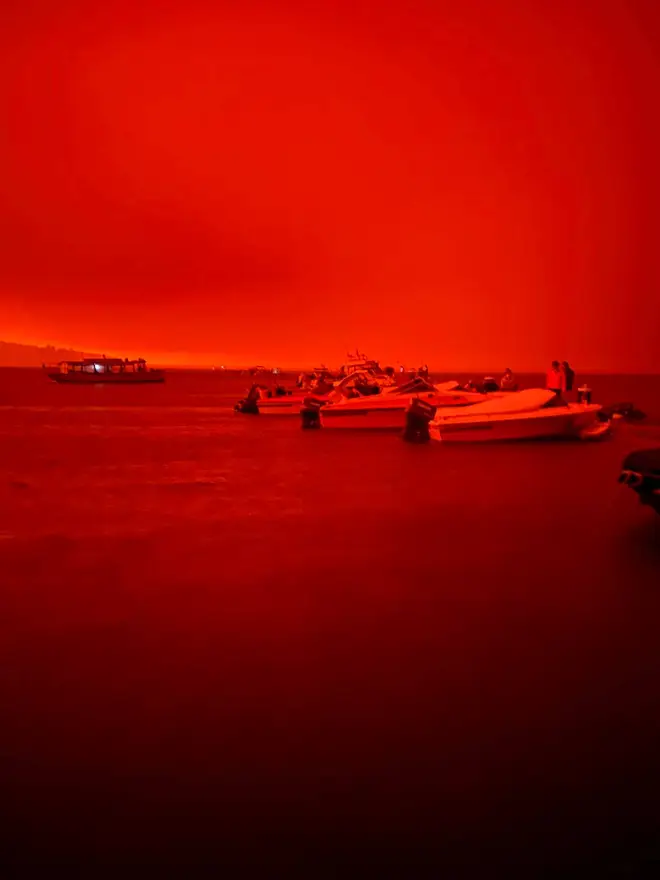 The red sky caused by burning boats