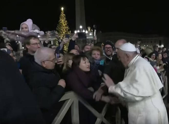 The Pope appeared to react angrily after he was grabbed