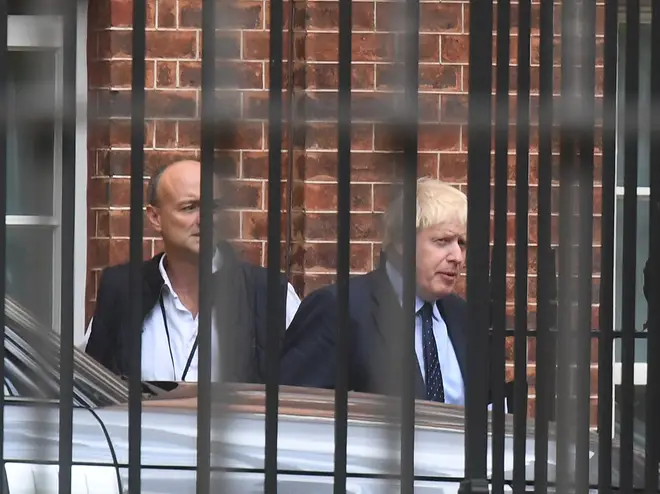Prime Minister Boris Johnson with his senior aid Dominic Cummings as they leave Downing Street