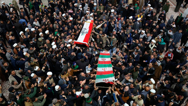 Mourners carry the coffins of Iran's Gen. Qassem Soleimani and Abu Mahdi al-Muhandis, deputy commander of Iran-backed militias