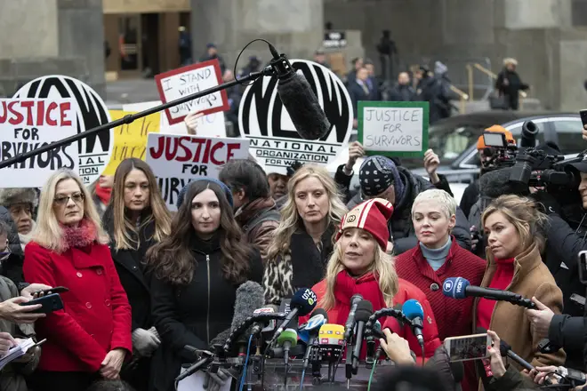 Actor Rose McGowan, right, speaks at a news conference as actor Rosanna Arquette, center left, listens outside a Manhattan courthouse after the arrival of Harvey Weinstein
