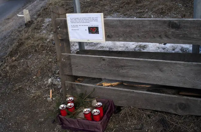 Candle and a commemoration letter placed at the at the scene where a car had plowed into a group of people in Luttach.