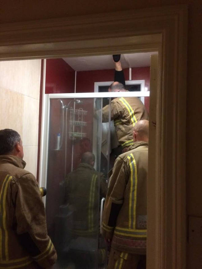 Fire fighters work to rescue the woman