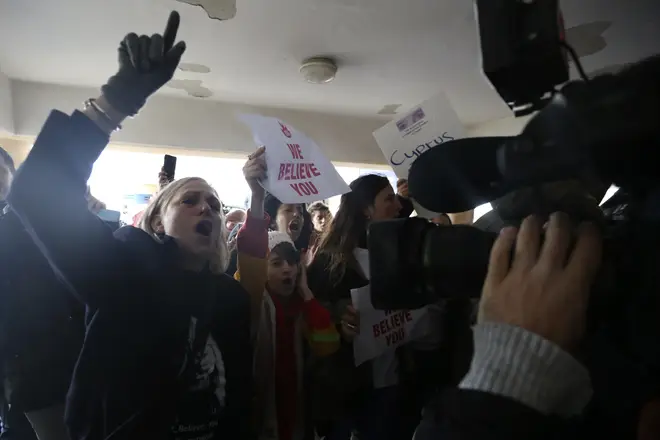 Protesters shout slogans outside a court before the arrival of a 19 year-old British woman that was found guilty of making up claims she was raped by up to 12 Israelis.