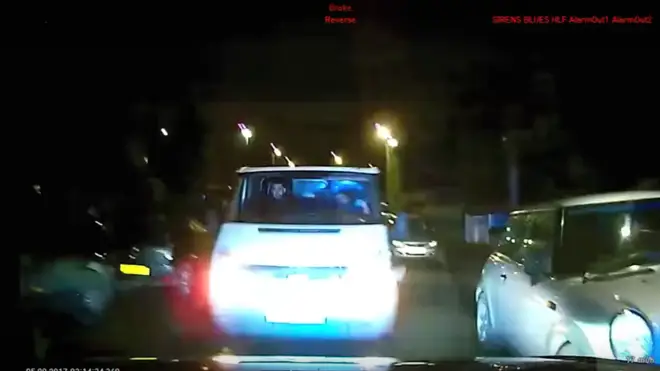The moment the van rammed the police car injuring two officers