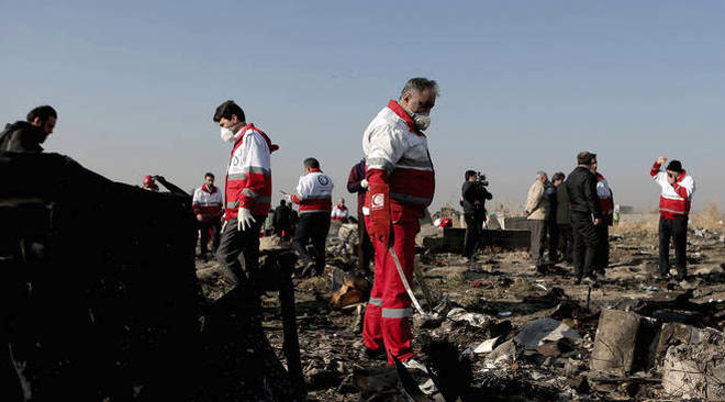 Rescue workers at the scene of the plane crash.