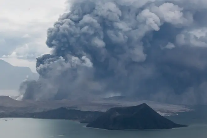 The Taal Volcano erupts with a massive plume of ash and steam in Batangas Province, the Philippines,