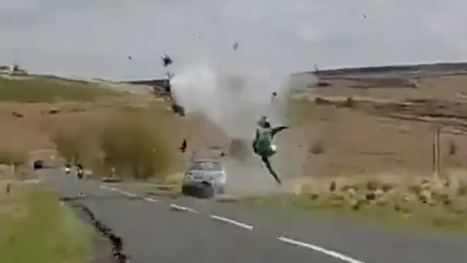 The biker flies through the air before hitting the ground