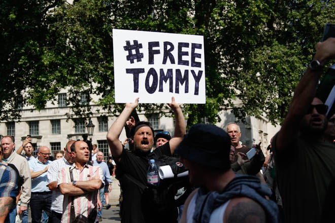A protester calling for the release of Tommy Robinson after the activist was jailed for contempt of court.