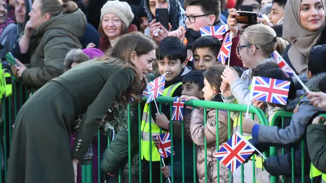 Kate greets some of the youngest in the assembled crowd