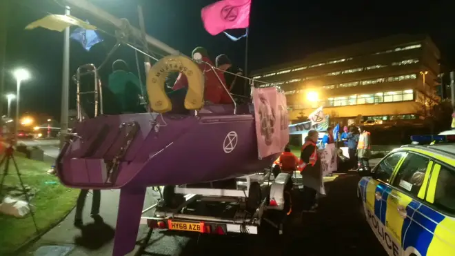 The protestors are using a huge purple boat
