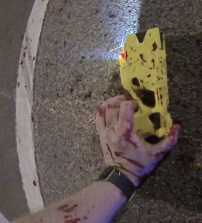 The taser PC Outten was holding, covered in his blood