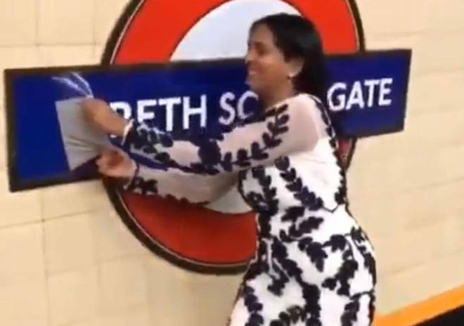 The woman sparked outrage after she was filmed pulling down the temporary sign