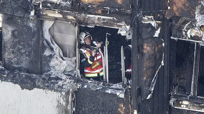 Firefighter working in burning Grenfell Tower