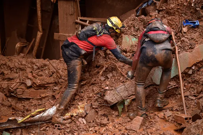 Rescue workers looking for victims in Vila Bernadete, Belo Horizonte