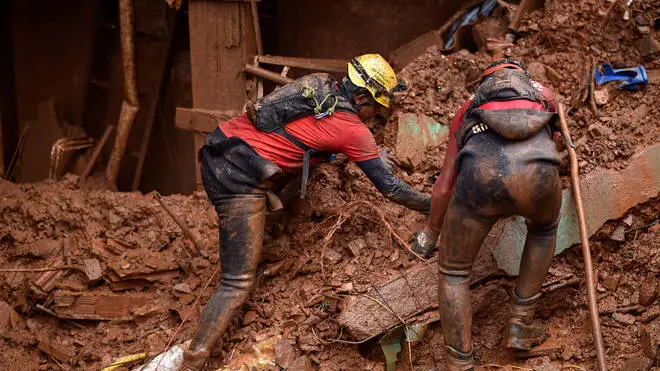 Rescue workers looking for victims in Vila Bernadete, Belo Horizonte
