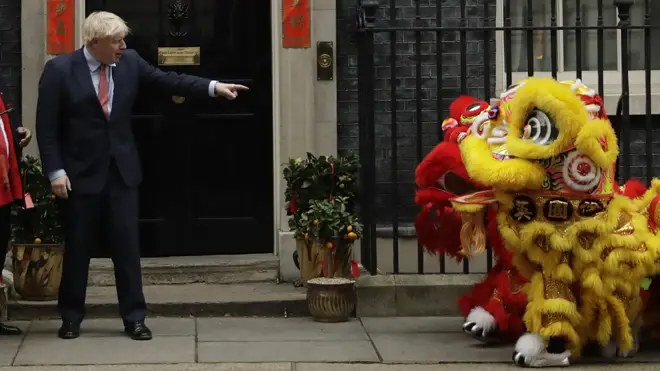 Boris Johnson points at performers dressed as lions as he welcomes members of the British Chinese community for Chinese New Year celebrations last week