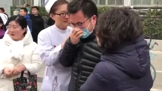 Footage shows family of drafted medical staff weeping as they set off for Wuhan