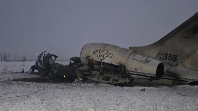 The burnt-out wreckage of the plane which crashed in Afghanistan