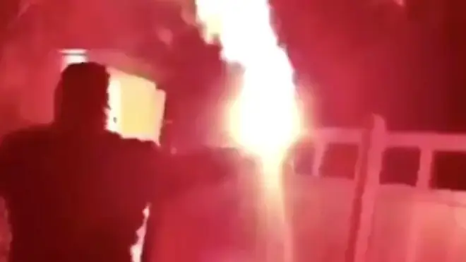 Snapchat footage appeared to show people throwing flares outside Mr Woodward's home